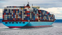 blue and red cargo ship on sea during daytime